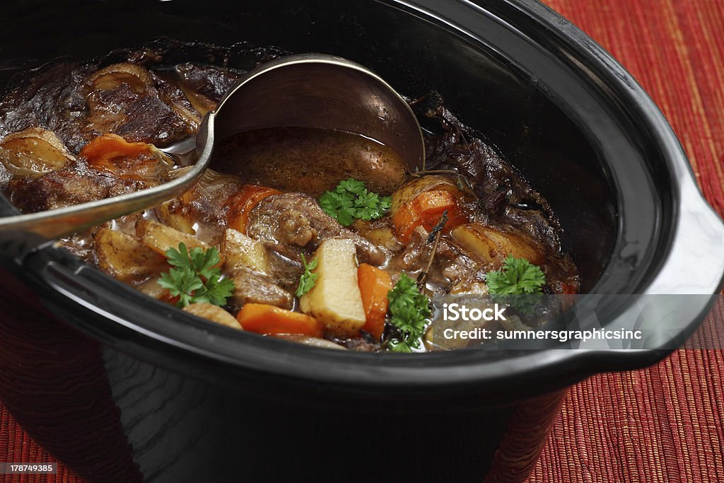 Irish stew in a slow cooker pot Photo of Irish Stew or Guinness Stew made in a crockpot or slow cooker. Crock Pot Stock Photo