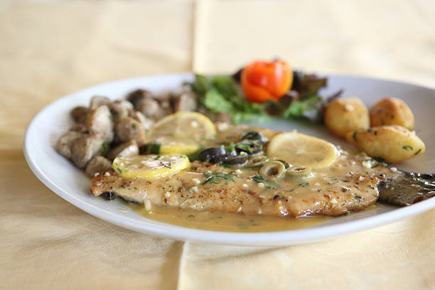 istock trout fish with lemon sauce 178749464
