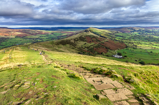 The stone path leading from Mam Tor, with a view along the pathway Great Ridge to Back Tor and Lose Hill, in the Peak District National Park, Derbyshire.