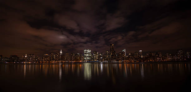 istock New York City night skyline and reflection from Brooklyn 178751768