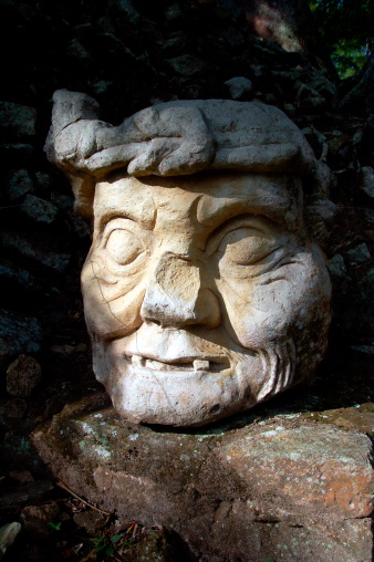 Mayan Head Sculpture on a Rock in Guatemala