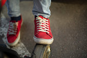 Red sneakers. Old shoes. Punk style.