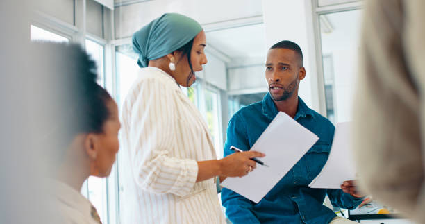 istock Business, woman and speaker with paper in training, workshop or conversation for feedback, target growth or goals. Talking, mentor or presentation with document review in teamwork collaboration 1787527391