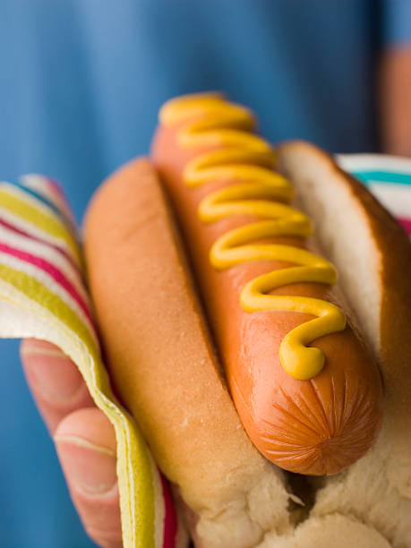 istock Hot Dog with Mustard in a Napkin 178753026