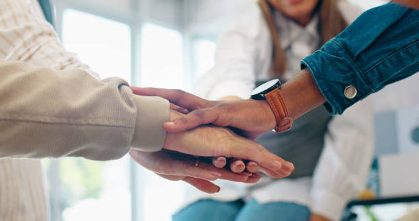 istock Creative people, hands together and meeting in team building, support or trust for goals, target or motivation at office. Group of employees piling in teamwork, solidarity or startup at workplace 1787531060