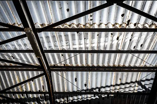 old corrugated polycarbonate roof with rusty construction.