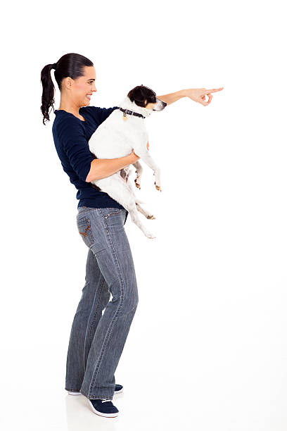 istock woman holding pet dog 178755300