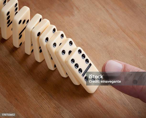 Finger Pushing Domino Pieces Stock Photo - Download Image Now - Adult, Backgrounds, Balance