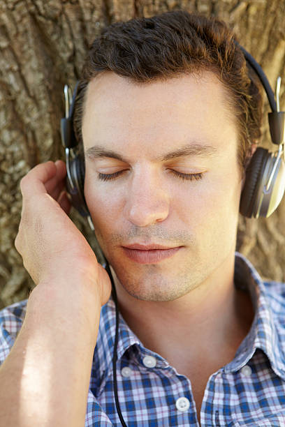 istock Young man listening music 178756487