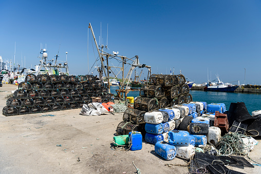 Lobster cages stacked up at Howth Harbour, Dublin, Ireland.