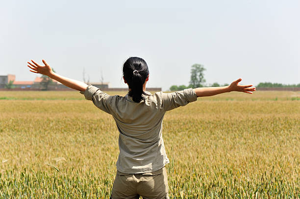 istock woman happy wheat field 178756816