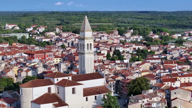 Drone video of the historic Croatian town of Voznjan in Istria with church bell tower
