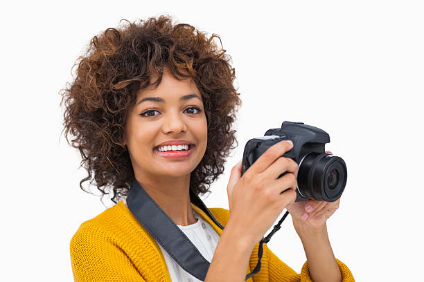 istock Smiling girl taking a photo and looking at camera 178757328