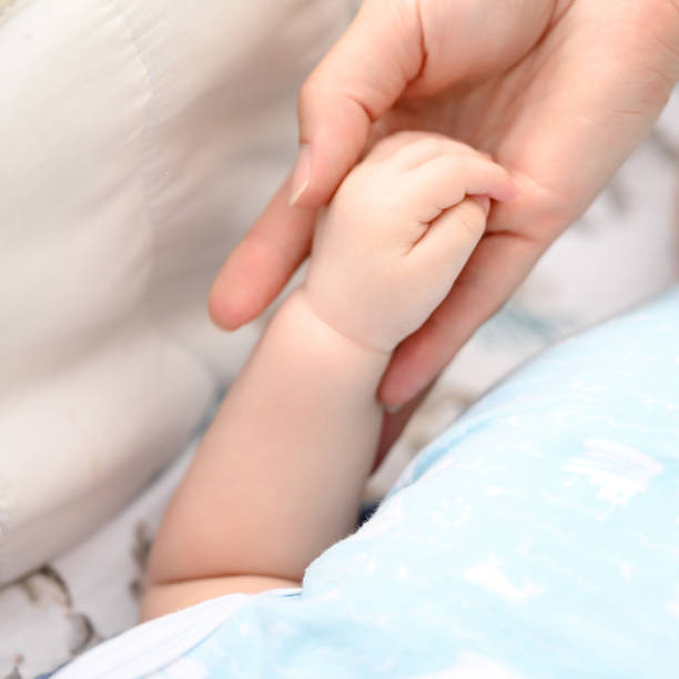 istock Close-up of a newborn baby's small hand. 1787578676