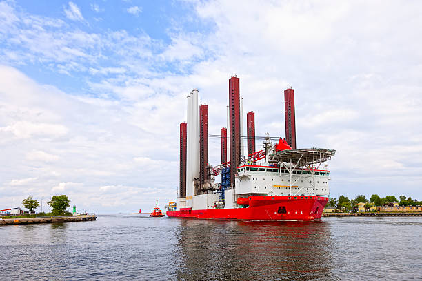 Specialist ship Specialist ship for the construction of wind turbine installation. floating electric generator stock pictures, royalty-free photos & images