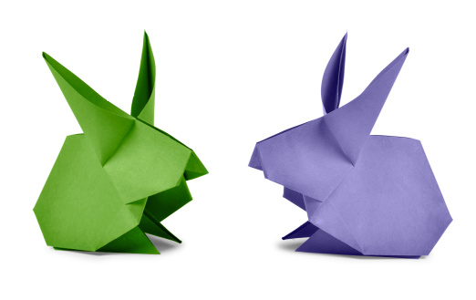 Origami. Paper rabbits isolated on white background