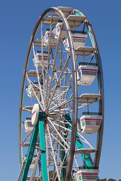istock Ferris Wheel at the Local Fair Against a Blue Sky 178759125