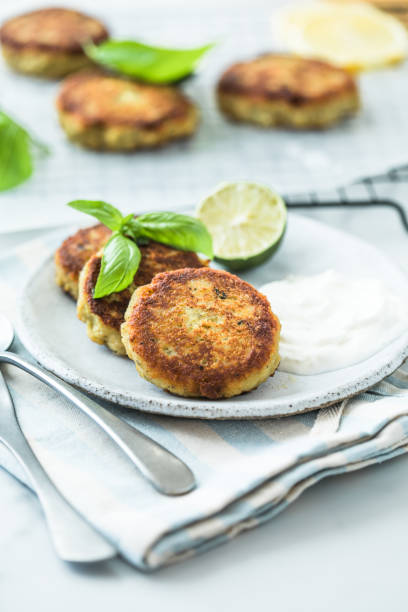 istock Traditional homemade fish cakes with tlemon and sour cream 1787597216