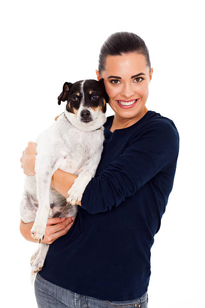 istock cheerful woman hugging her dog 178760028