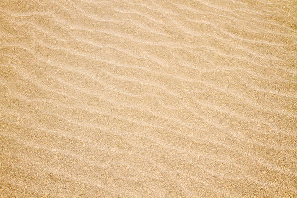 sfondo di sabbia - sand wave pattern beach wave foto e immagini stock