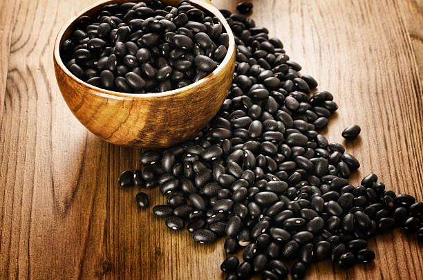 istock Black beans on wooden background 178760641