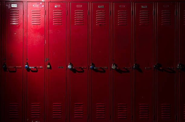 Row of Lockers image of a row of lockers with dramatic lighting locker stock pictures, royalty-free photos & images