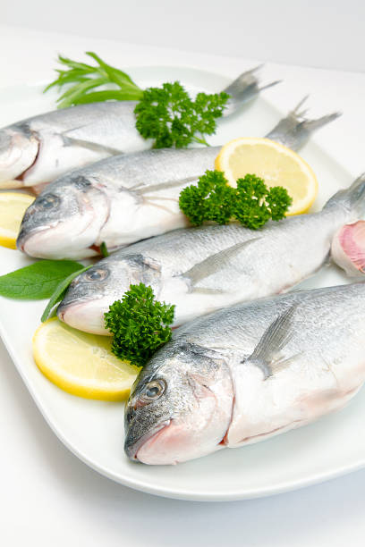 istock Raw sea breeves with lemon slices 178761073
