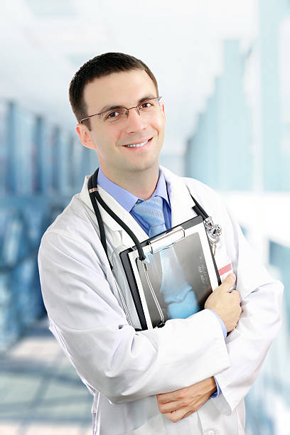 istock Friendly medical doctor with a x-ray image. 178761252