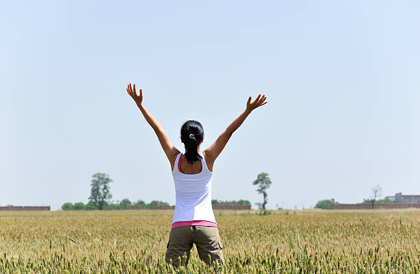istock woman happy wheat field 178761926