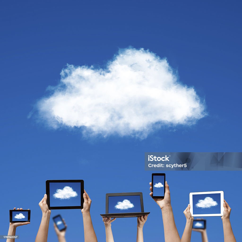 cloud computing cloud computing concept. hands holding computer laptop smart phone tablet and touch pad Blue Stock Photo