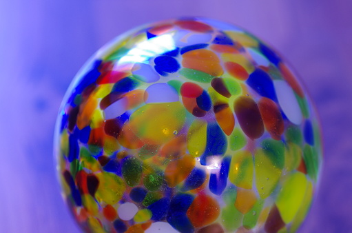 Decorative colorful glass ball close-up