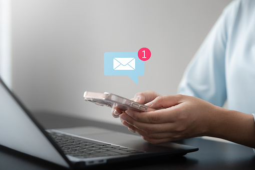 Email notification, businesswoman using smartphone with email notification icons, technology, internet, connection and innovation.