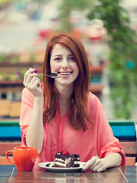 istock Style redhead girl with cake and cup 178762512