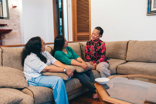 senior woman discuss with her daughter at home