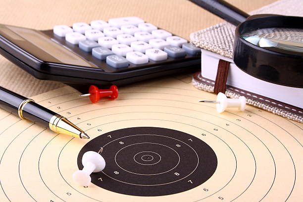 istock Find the target - magnifying glass, calculator, pen, pins 178763039