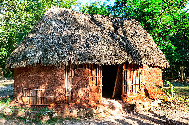 traditional mayan home mayan home Chichen Itza in the yucatan was a Maya city and one of the greatest religious center and remains today one of the most visited archaeological site thatched roof hut straw grass hut stock pictures, royalty-free photos & images