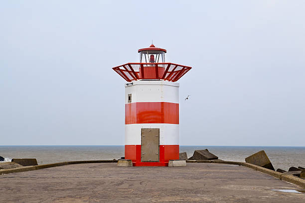 istock red and white lighthouse in the Hague, Holland 178763882