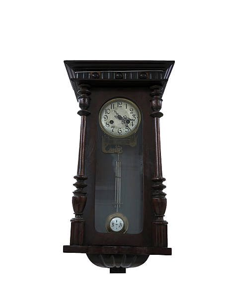 istock 19th Century old pendulum wooden clock isolated on white 178764214