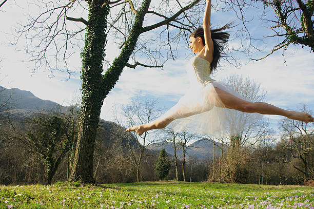 istock Beautiful young woman jumping 178764499