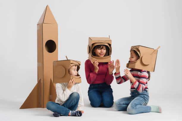 istock Children playing role play game as astronauts on mars. 1787655932