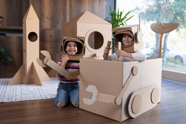 istock Children playing role play game as astronauts on mars. 1787662030