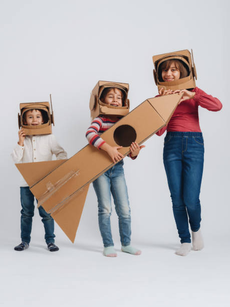 istock Children playing role play game as astronauts on mars. 1787663150