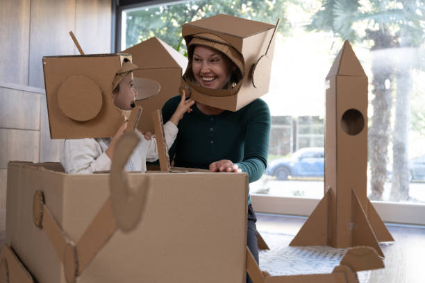 istock Mother and little son playing role play game as as astronauts on mars. 1787664863