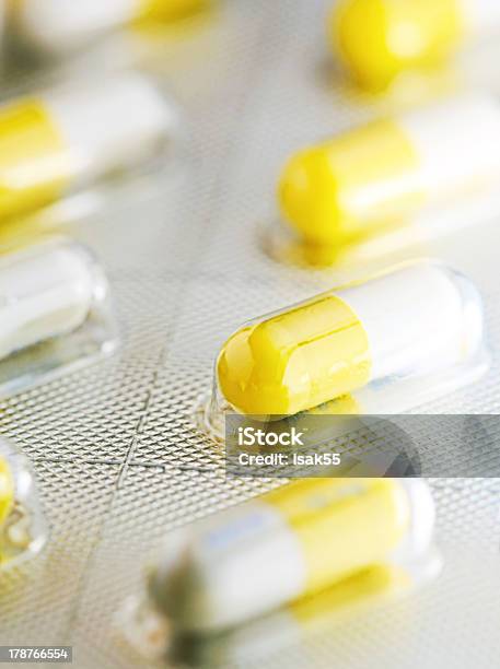 Yellow And White Pills Stock Photo - Download Image Now - Acetylsalicylic Acid, Addiction, Antibiotic