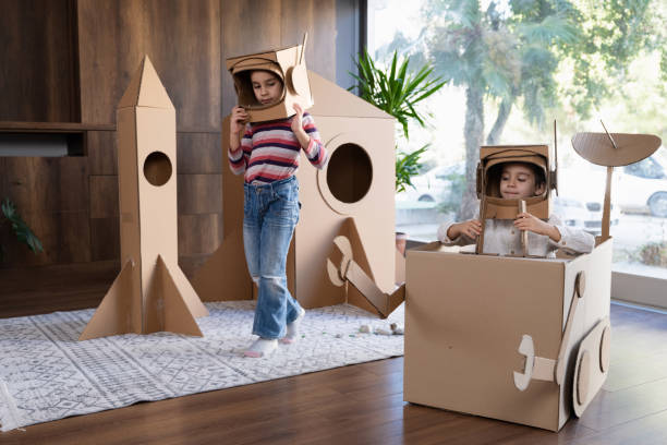 istock Children playing role play game as astronauts on mars. 1787666522