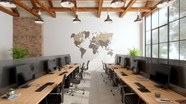Modern Open Plan Office Interior With Office Chairs, Computers, Plants And World Map Wall Decoration