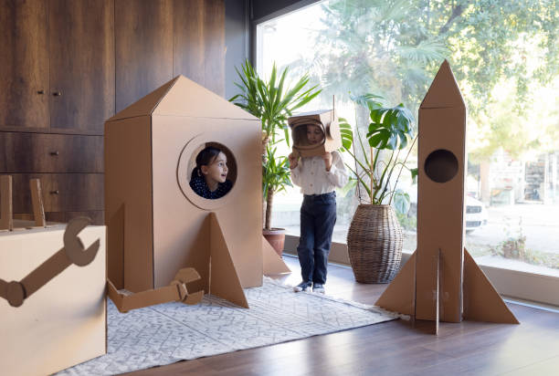 istock Children playing role play game as astronauts on mars. 1787672007