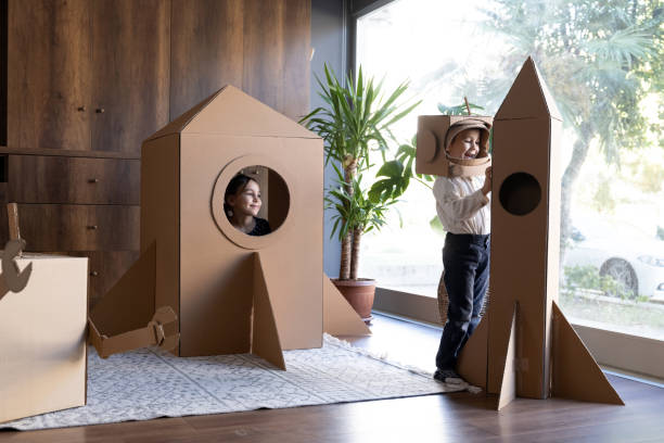 istock Children playing role play game as astronauts on mars. 1787673095