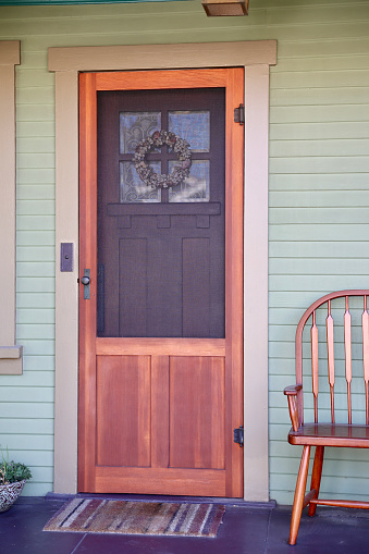 Whimsical brightly colored vintage cottage with charming front door