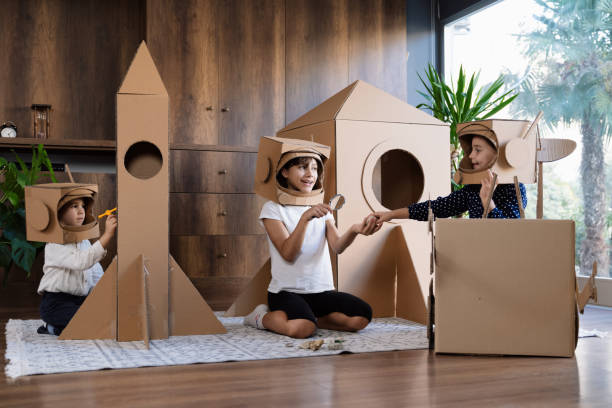 istock Children playing role play game as astronauts on mars. 1787680140